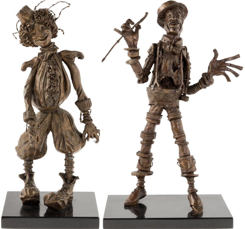 Bronze statues of Scarecrow and Tin Man designed by Tony Walton for The Wiz.
